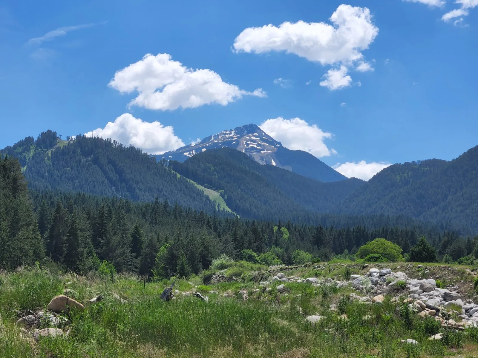 Scenic view of Bansko ski resort with snow-capped Pirin mountains